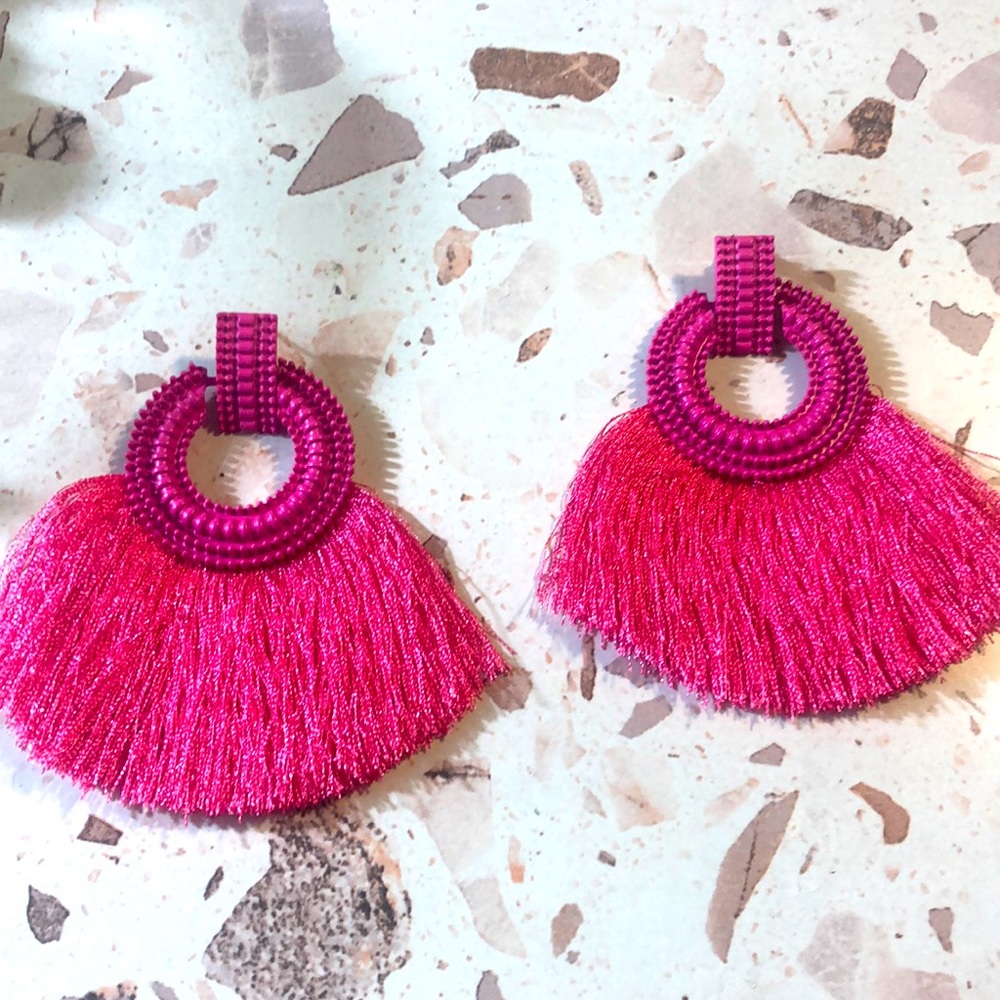 Attractive Pink frilly earrings.
